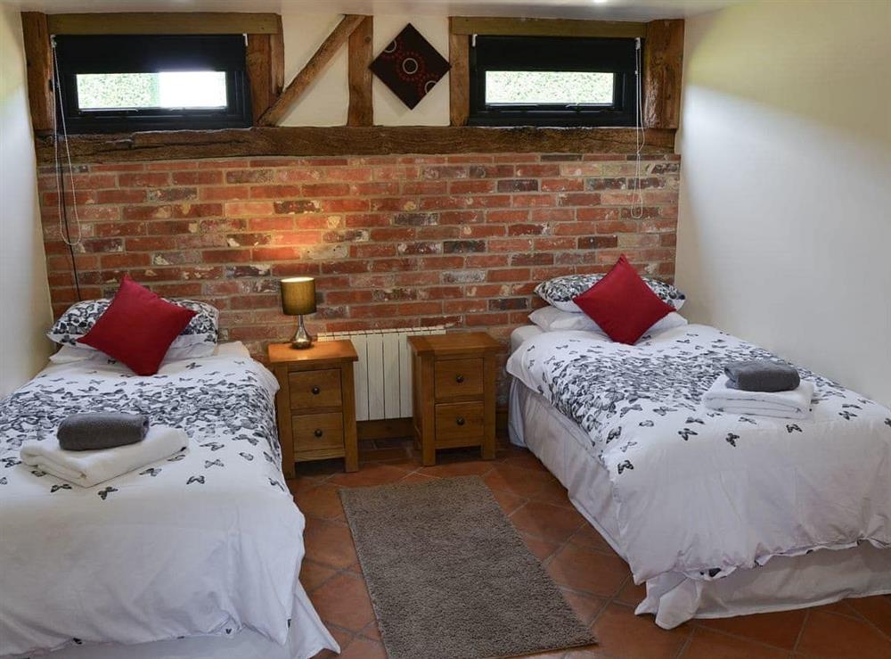 Twin bedroom at Clamp Farm Barn in Creeting St Peter, near Stowmarket, Suffolk