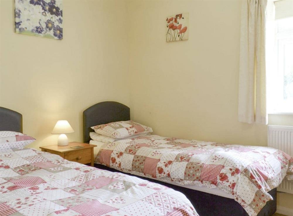 Relaxing twin bedroom at Cowslip Cottage, 