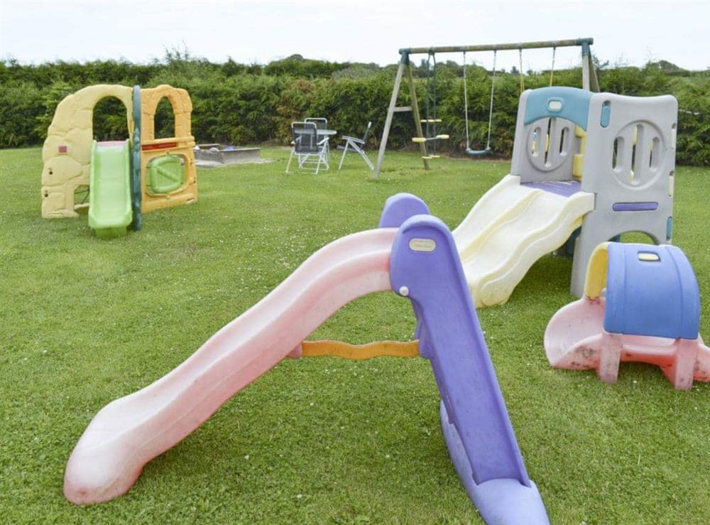 Spacious outdoor children’s play area at Cowslip Cottage, 