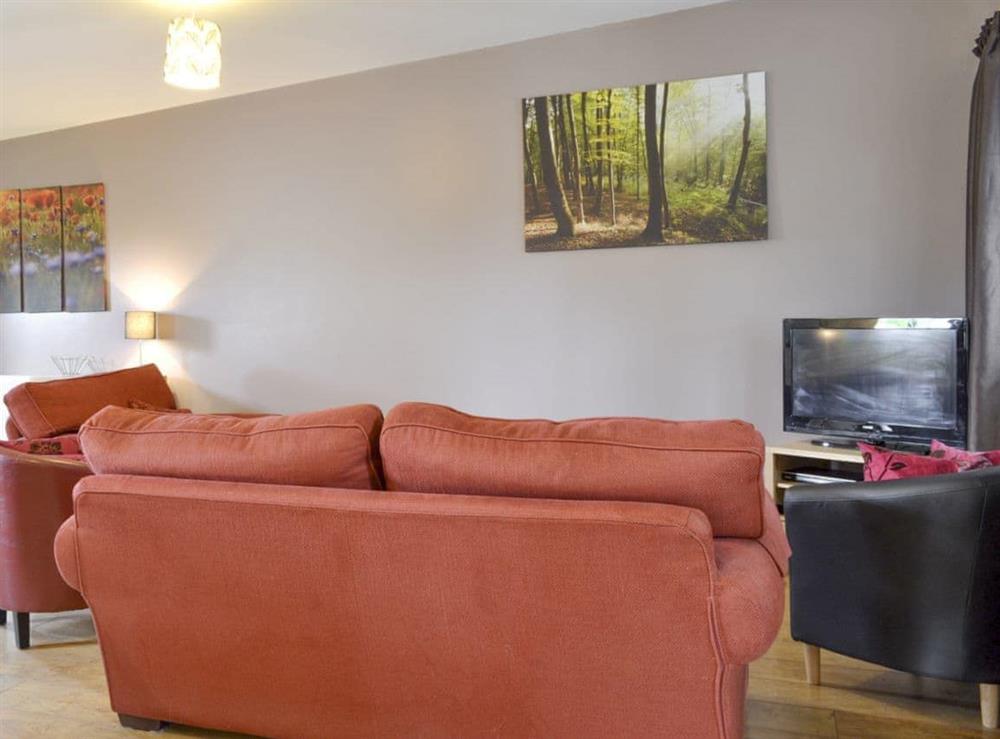 Spacious seating area of open-plan living space at Cowslip Cottage, 
