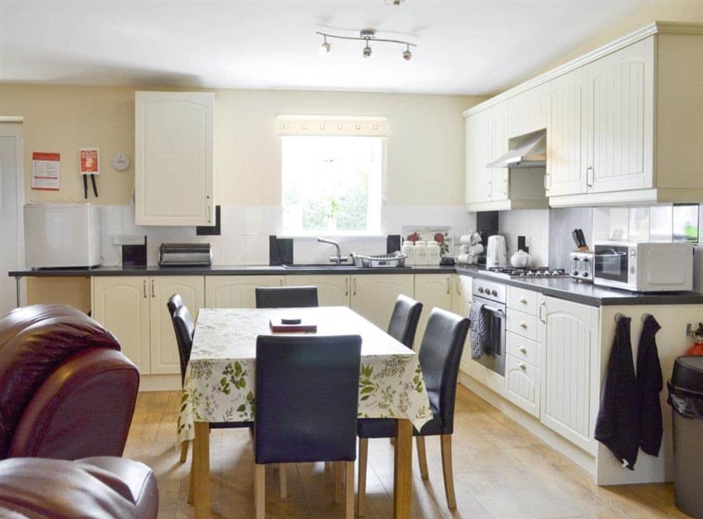 Convenient dining area and well-equipped kitchen at Primrose, 
