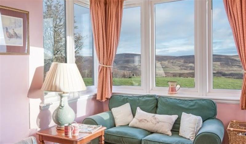 Relax in the living area (photo 3) at Clashindeugle Farmhouse & Annex, Grantown-on-Spey