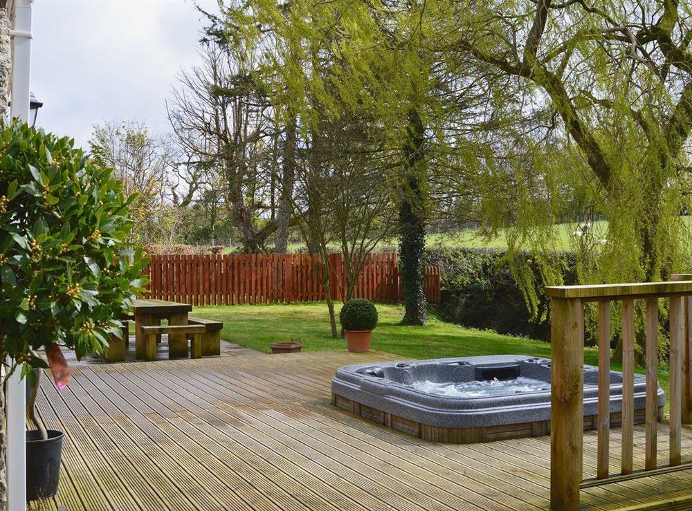 Patio with hot tub at Clawdd Offa in Penyffordd, near Chester, Cheshire