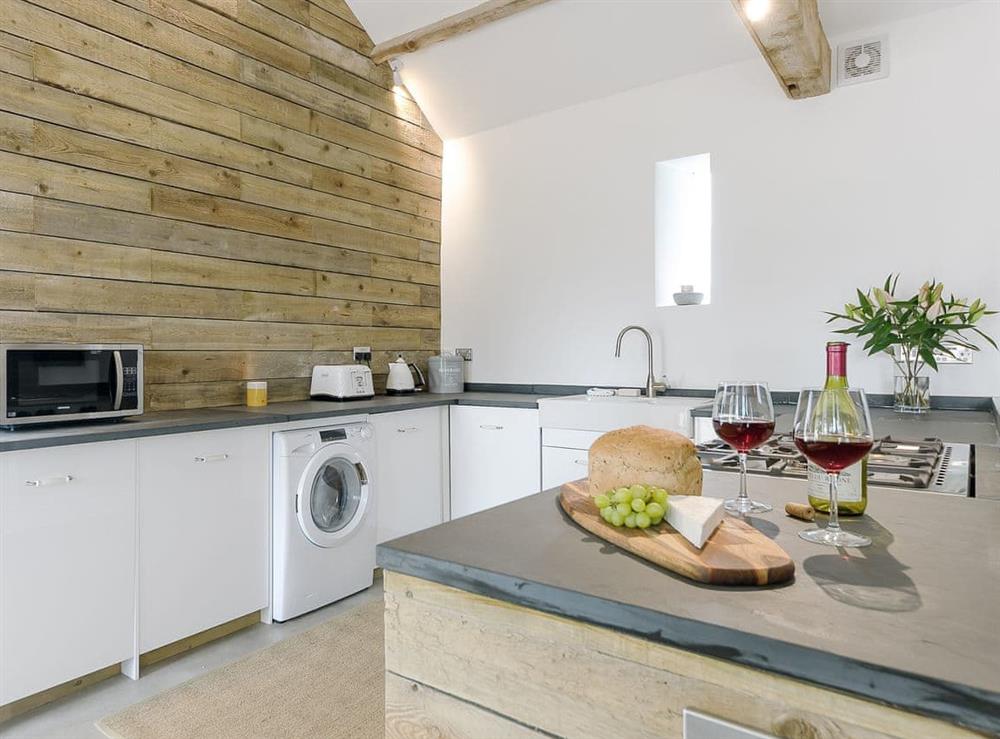 Kitchen area with lovely rustic wooden charm at Clawdd-Y-Parc in near Llangybi, Gwent