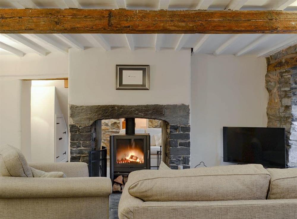 Characterful living room with wood burner at Clawwd Gwyn in Trefriw, near Llanrwst, Gwynedd