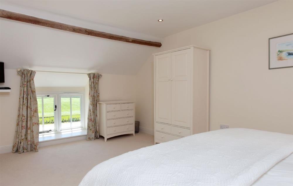 Bedroom three with super-king bed and en-suite bathroom (photo 2) at Clayhanger Lodge, Abbotsbury