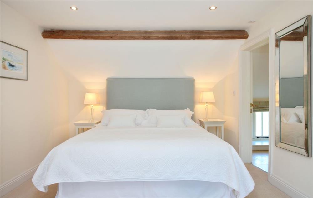 Bedroom three with super-king bed and en-suite bathroom at Clayhanger Lodge, Abbotsbury