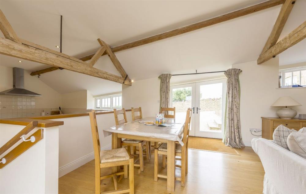 Dining area with table and chairs for six guests at Clayhanger Lodge, Abbotsbury