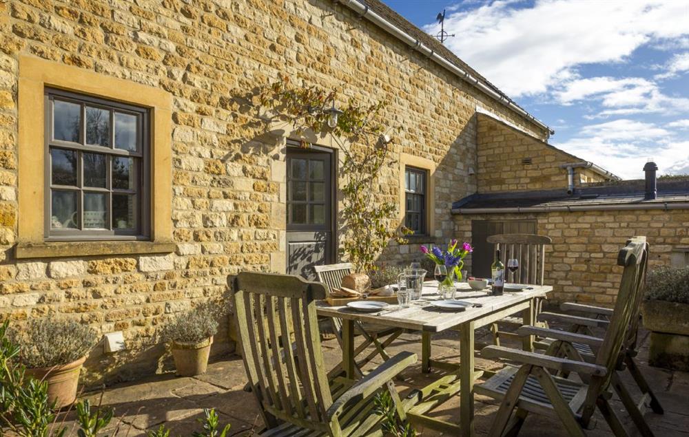 The rear patio terrace is ideal for outdoor dining at Claytons Cottage, Lower Oddington