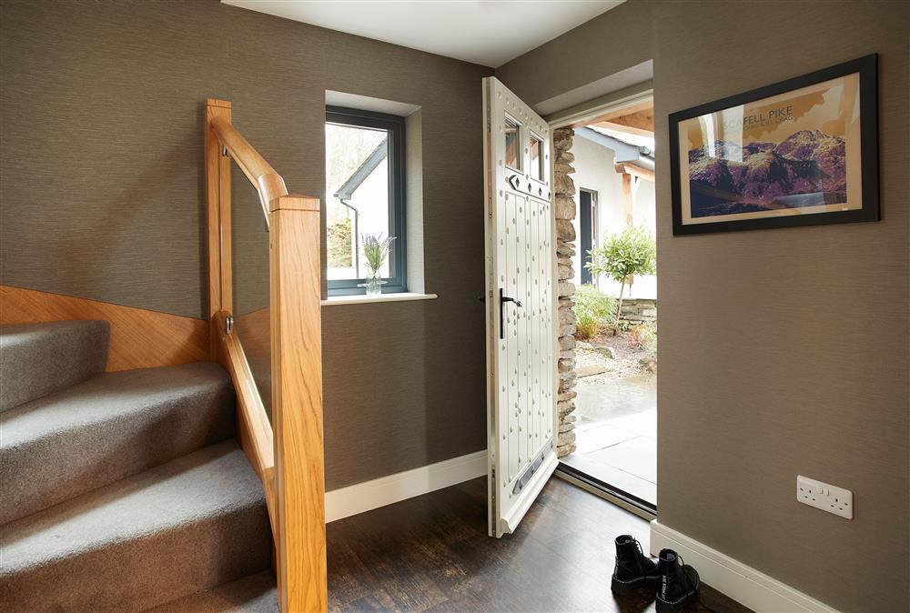 Cleabarrow View, Lake District: The entrance hall with feature glazed and oak staircase