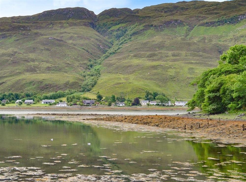 View across the Loch looking towards the property (second building on the right) at Clear Waters in Dornie, near Kyle of Lochalsh, Highlands, Ross-Shire
