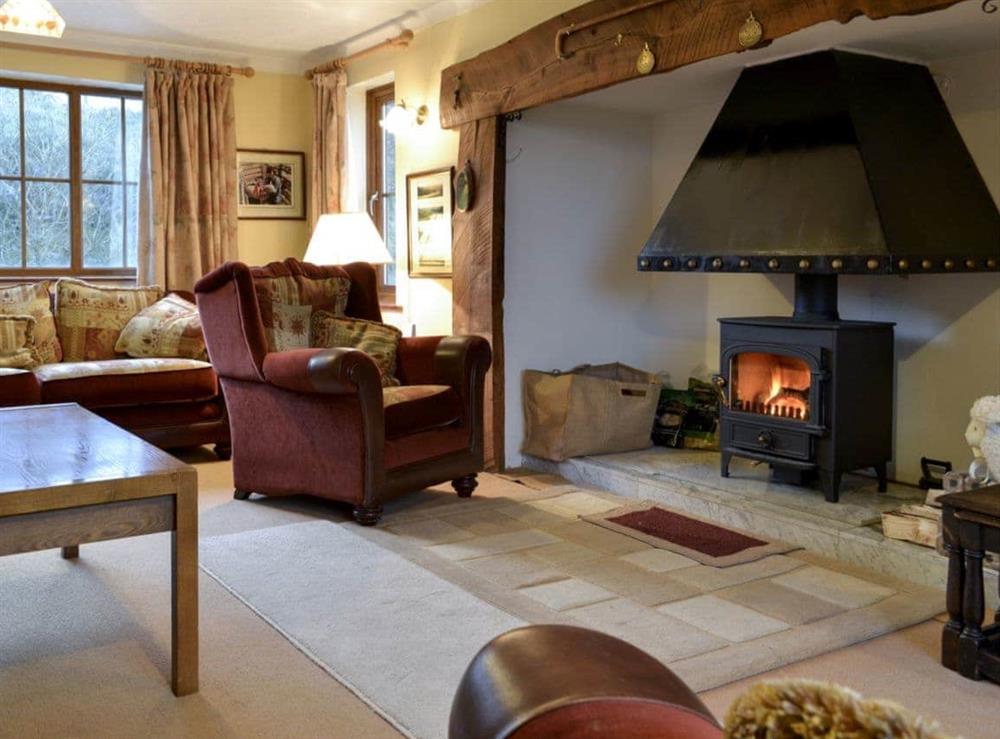 Cosy and warn living room with a large inglenook (photo 2) at Cleiriach in Llansannan, near Betws-y-Coed, Clwyd