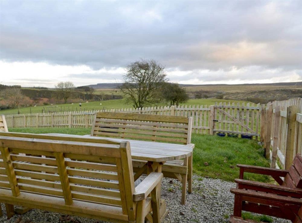 Enclosed lawned garden and furniture at Cleiriach in Llansannan, near Betws-y-Coed, Clwyd