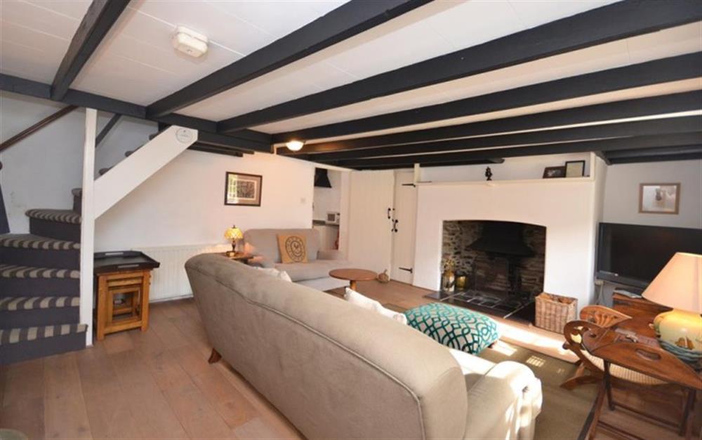 Character features abound, including steep stairs and a superb fireplace with wood burner at Clematis Cottage in Bantham