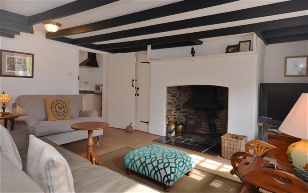 Spacious lounge with fabulous inglenook at Clematis Cottage in Bantham