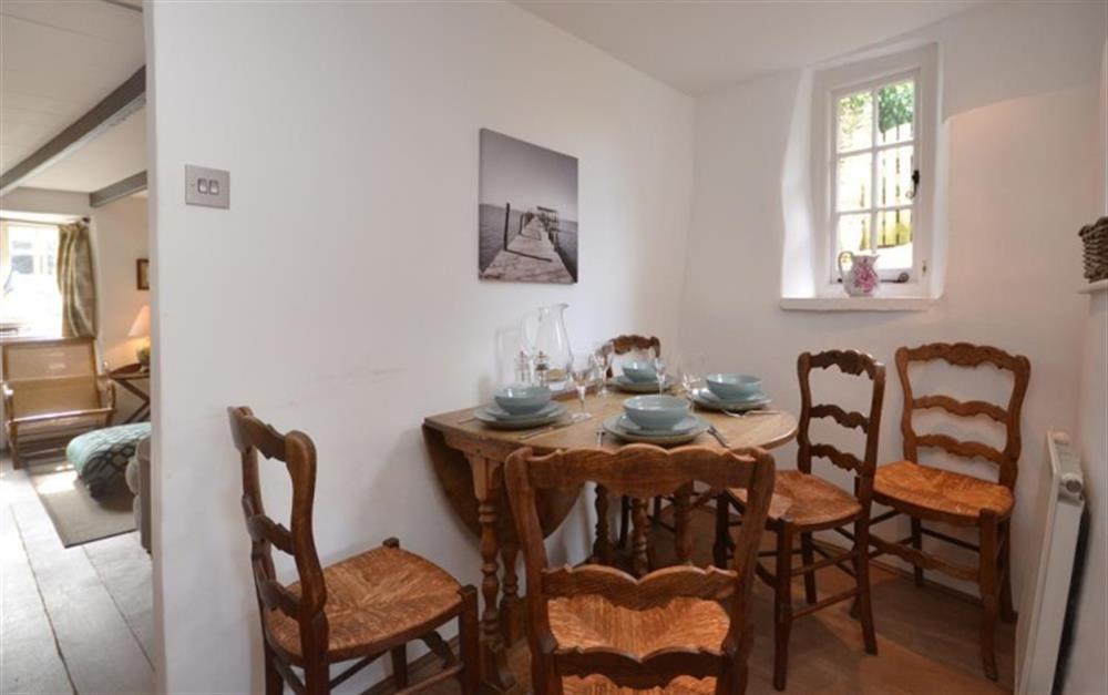 The dining area, a cosy nook off the kitchen at Clematis Cottage in Bantham