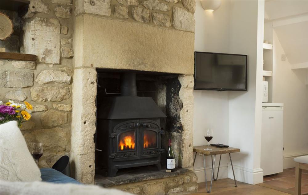 Traditional wood burning stove to enjoy during your stay at Clematis Cottage, Blockley