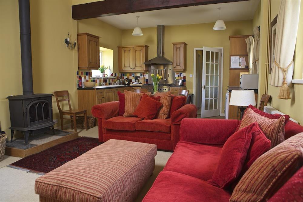 Lounge with wood burning stove at Clementine Cottage in Malborough, Nr Salcombe
