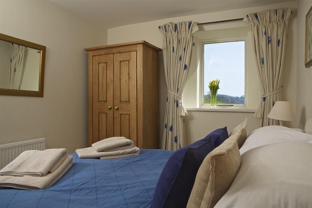 Master bedroom with King-size bed (photo 2) at Clementine Cottage in Malborough, Nr Salcombe