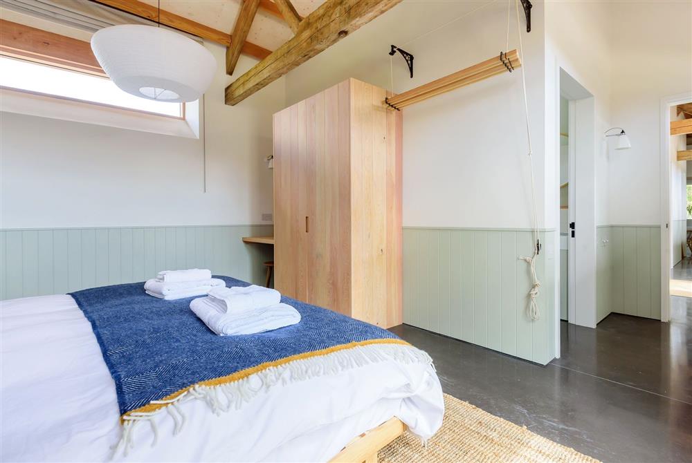 Bedroom one with a 6’ super king-size bed and an en-suite bathroom at Clementine, Dorchester