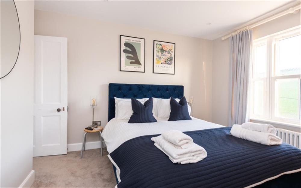 1st floor bedroom 1 with king-size bed and en suite shower room.  at Clevedon in Hope Cove