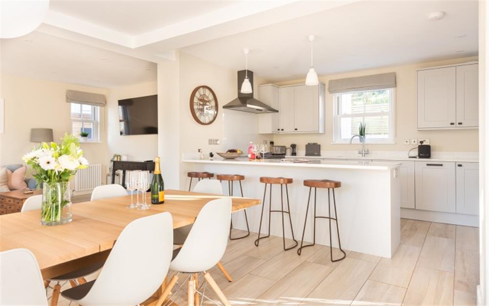Modern kitchen diner with breakfast bar.  at Clevedon in Hope Cove