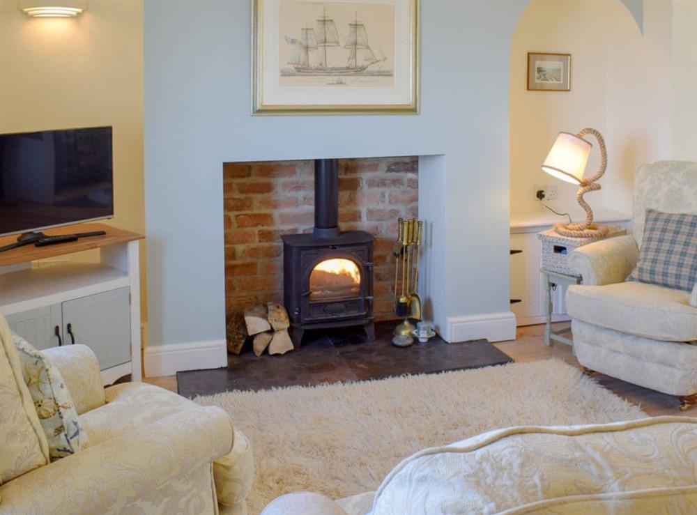 Cosy living area with wood burner at Cleveland Way Cottage in Skinningrove, near Saltburn-by-the-Sea, Cleveland