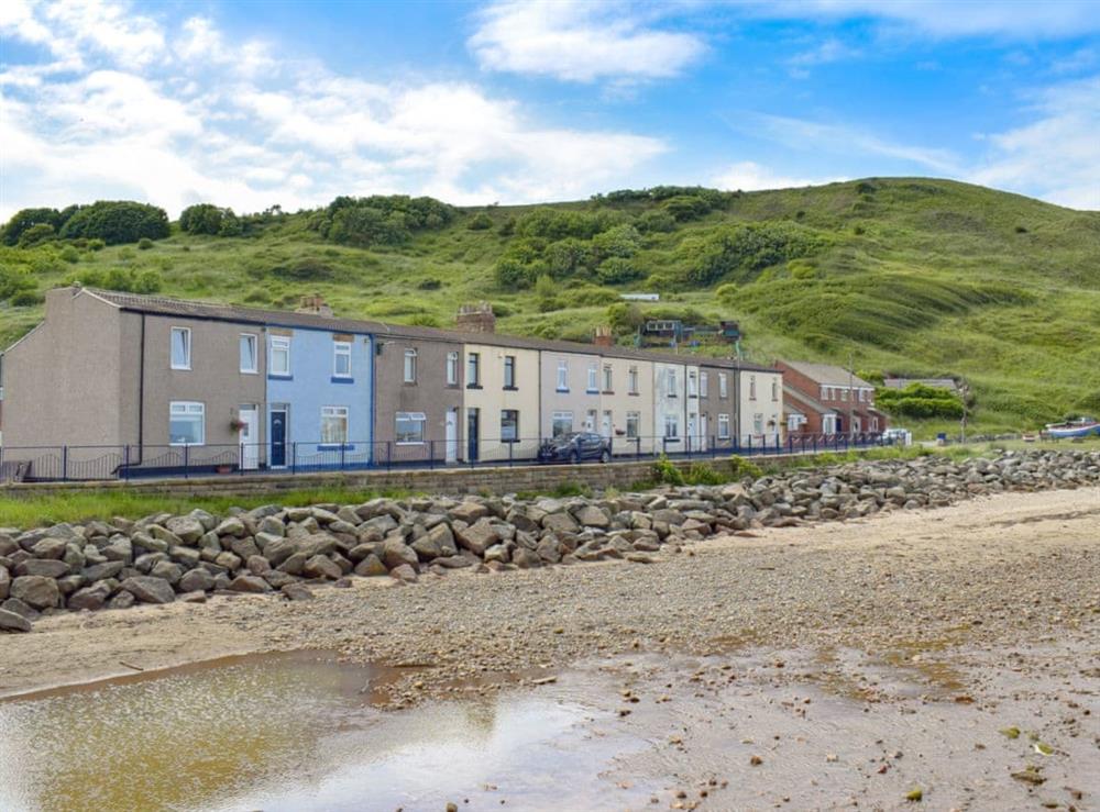 Delightful holiday home in a wonderful location (left on the photo) at Cleveland Way Cottage in Skinningrove, near Saltburn-by-the-Sea, Cleveland