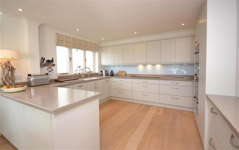 The well equipped modern kitchen with Corian work surfaces at Cliff Crest in Kingsbridge