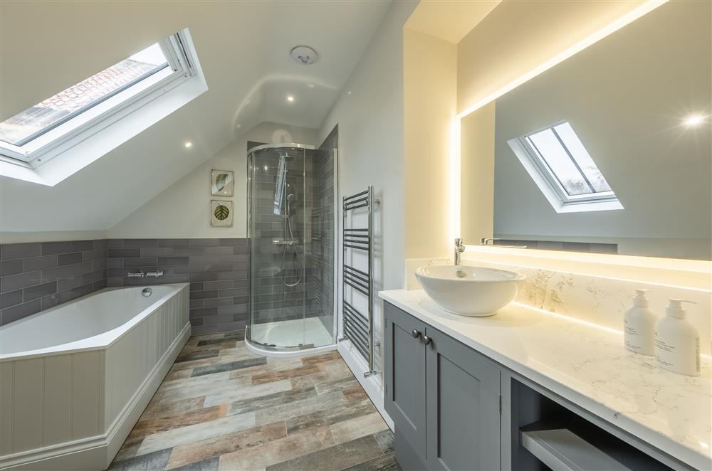 Bedroom two’s en-suite bathroom with bath and separate walk-in shower at Cliff Farmhouse, Lincoln
