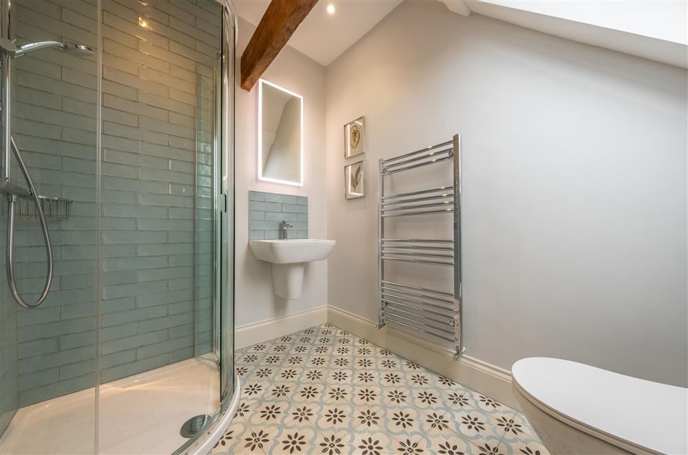 Family shower room on the second floor with walk-in shower and heated towel rail at Cliff Farmhouse, Lincoln