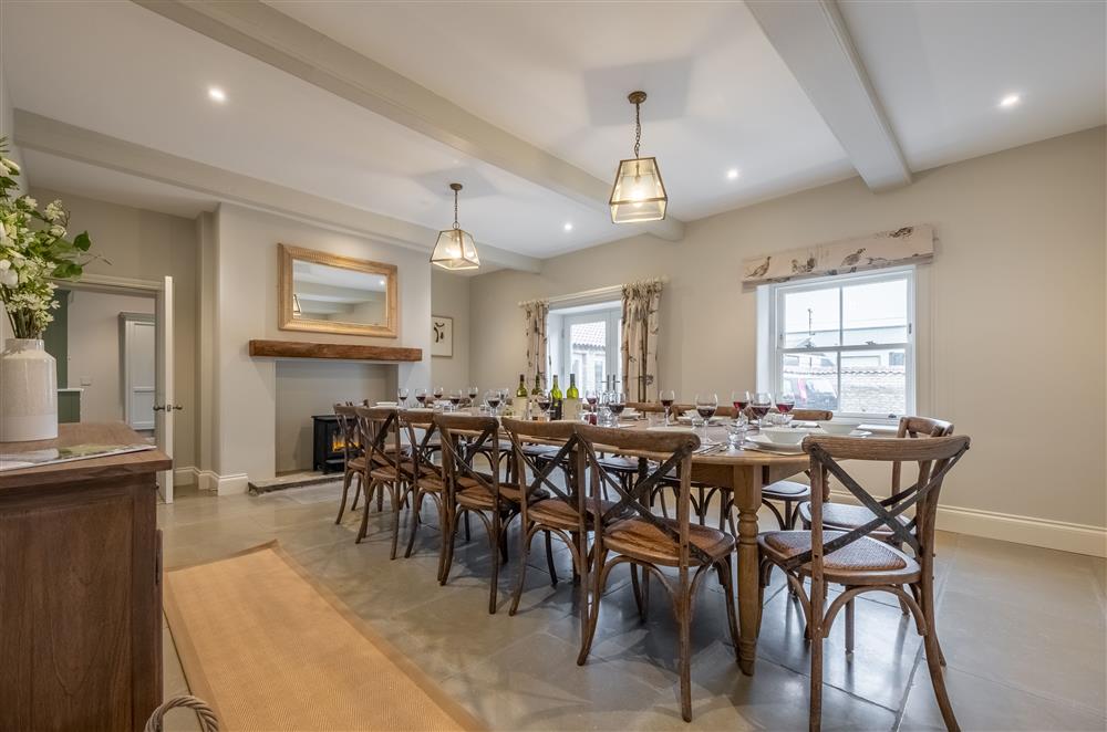 Generous dining room with electric stove and exposed beams at Cliff Farmhouse, Lincoln