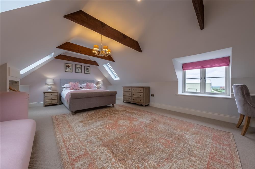 Opulent bedroom one on the second floor with a 5’ king-size bed at Cliff Farmhouse, Lincoln