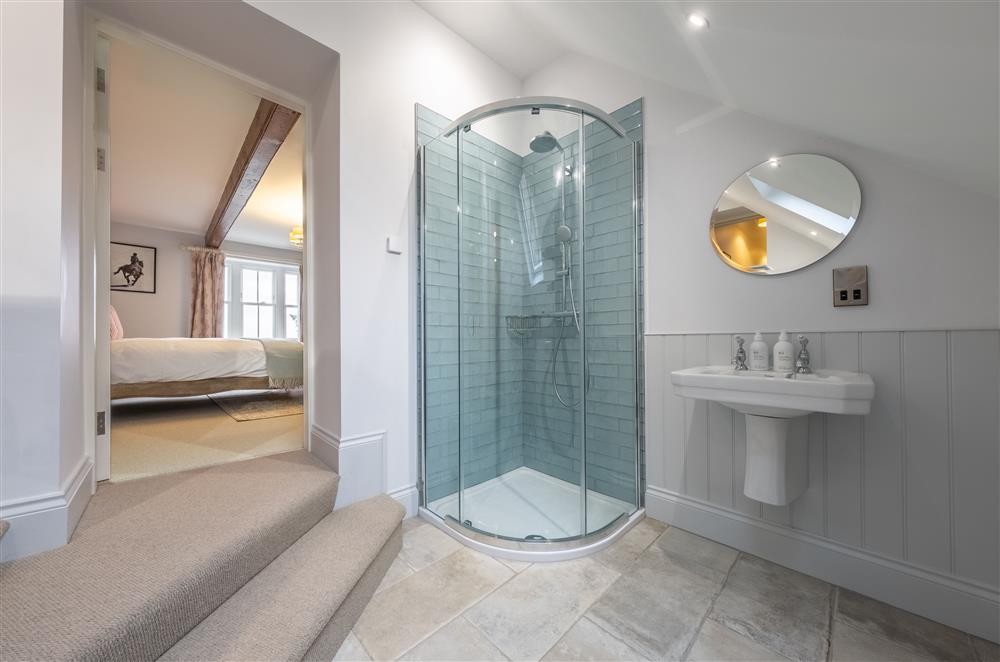 Two steps down lead to bedroom three’s en-suite shower room at Cliff Farmhouse, Lincoln