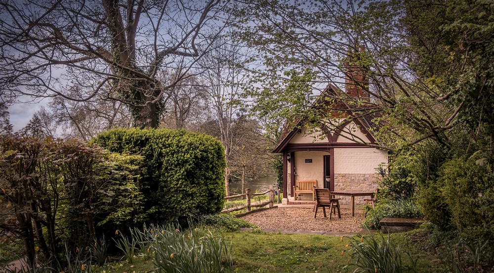 Cliveden Ferry Cottage, viewed from the end of its garden, Berkshire at Cliveden Ferry Cottage in Nr Maidenhead, Berkshire