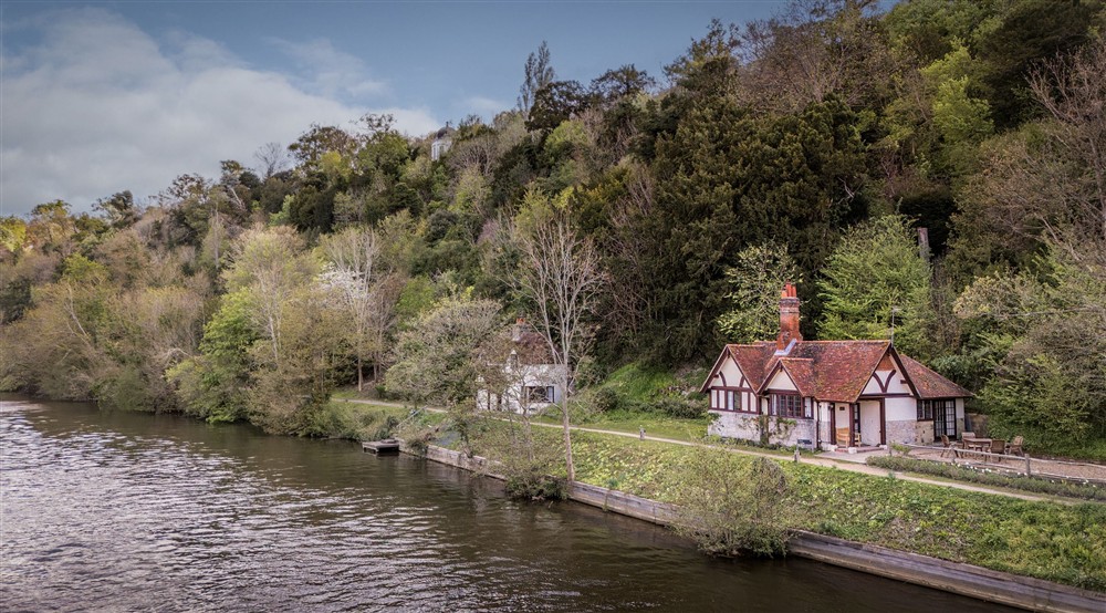 An aerial view of Cliveden Ferry Cottage, on the bank of the River Thames, Berkshire at Cliveden New Cottage in Nr Maidenhead, Berkshire