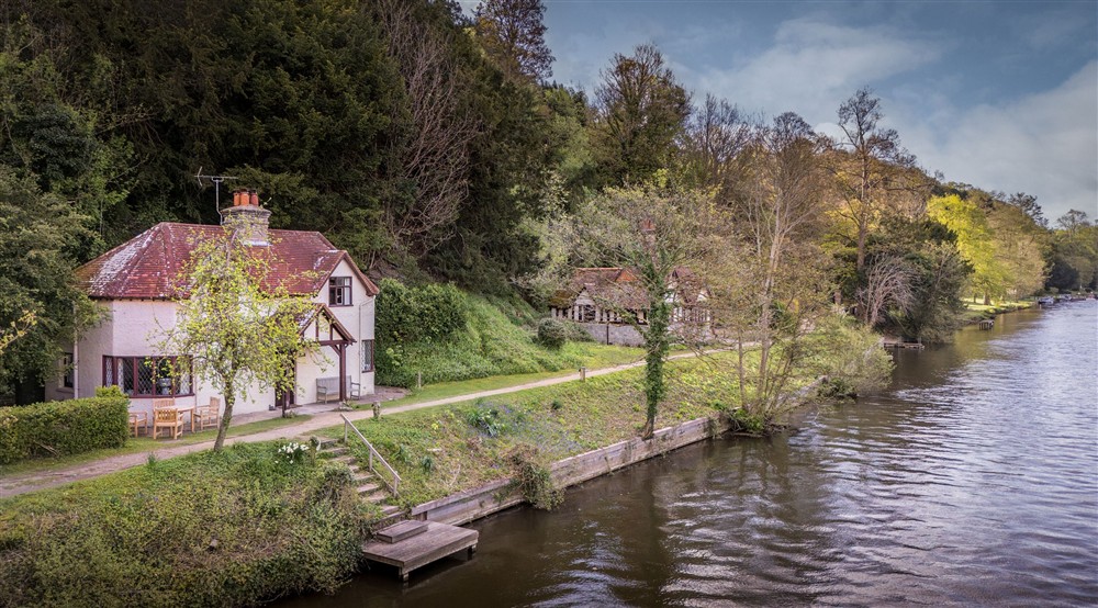 An aerial view of Cliveden New Cottage and Cliveden Ferry Cottage, on the banks of the River Thames, Berkshire at Cliveden New Cottage in Nr Maidenhead, Berkshire
