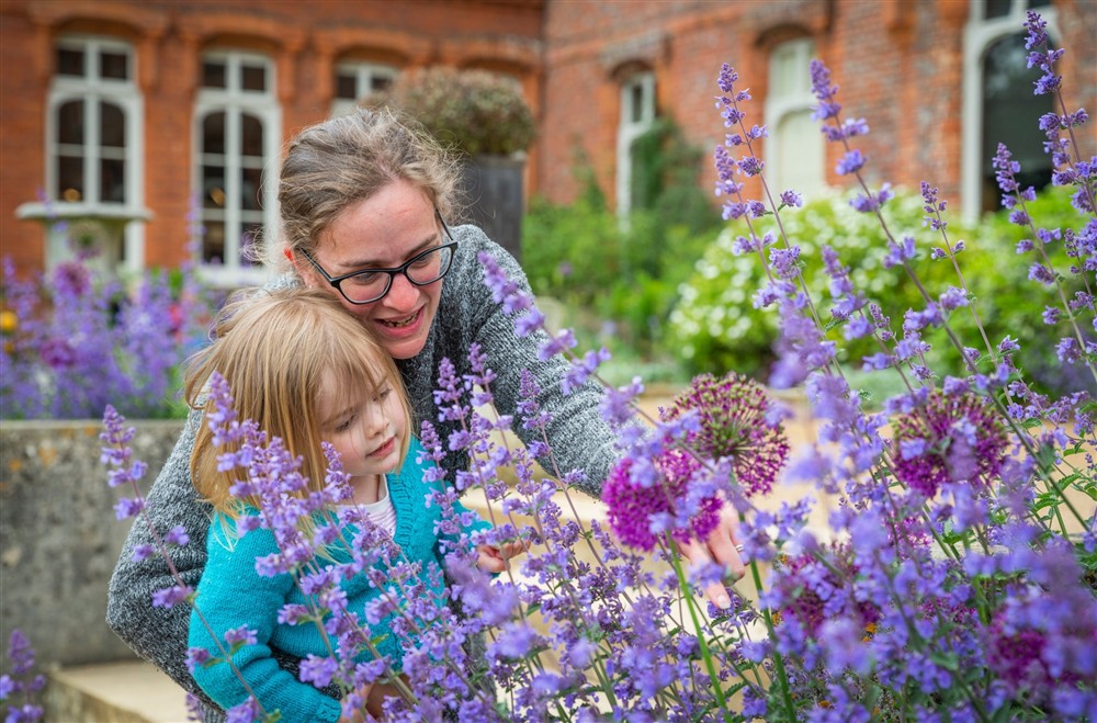 Families exploring the garden at Cliveden New Cottage in Nr Maidenhead, Berkshire