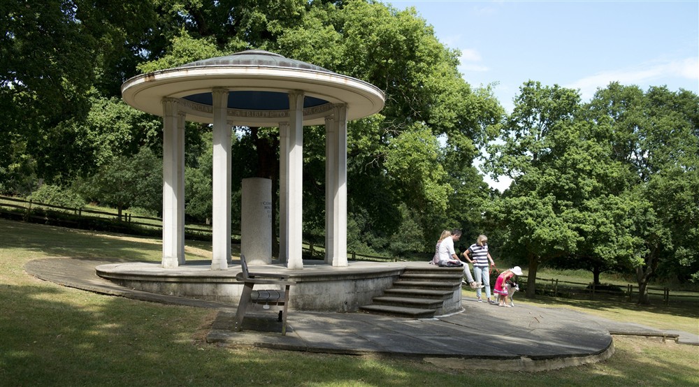 Family and their dog sitting by step at Cliveden New Cottage in Nr Maidenhead, Berkshire