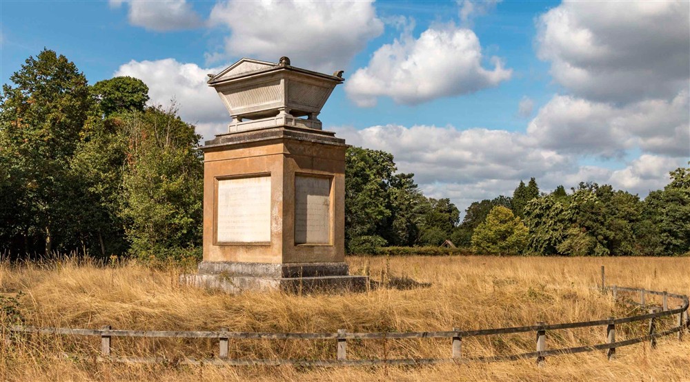 Grays Monument shown in Grays Field surrounded by long summer grass at Cliveden New Cottage in Nr Maidenhead, Berkshire