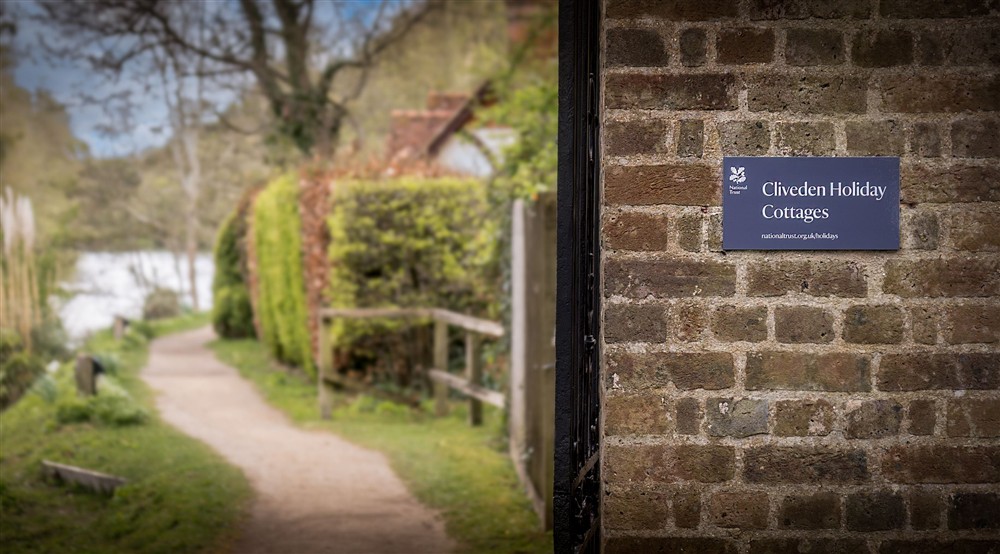The sign by the riverside path to the holiday cottages at Cliveden New Cottage in Nr Maidenhead, Berkshire
