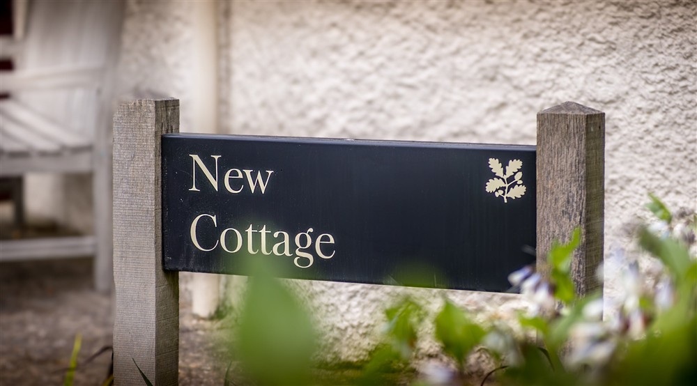 The sign for Cliveden New Cottage, Berkshire at Cliveden New Cottage in Nr Maidenhead, Berkshire