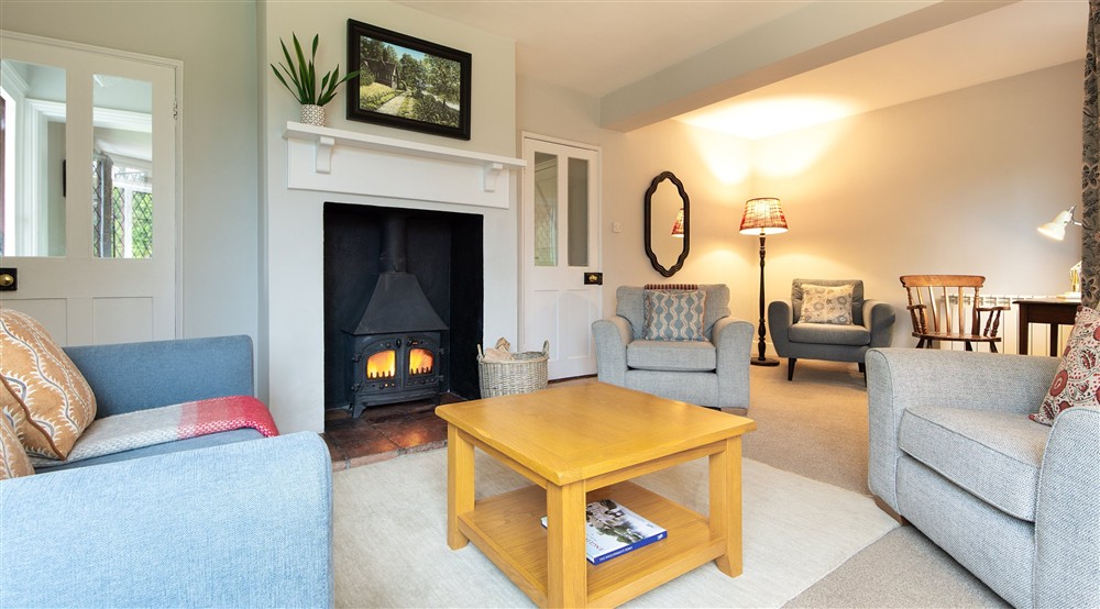 The sitting room with woodburner at Cliveden New Cottage in Nr Maidenhead, Berkshire