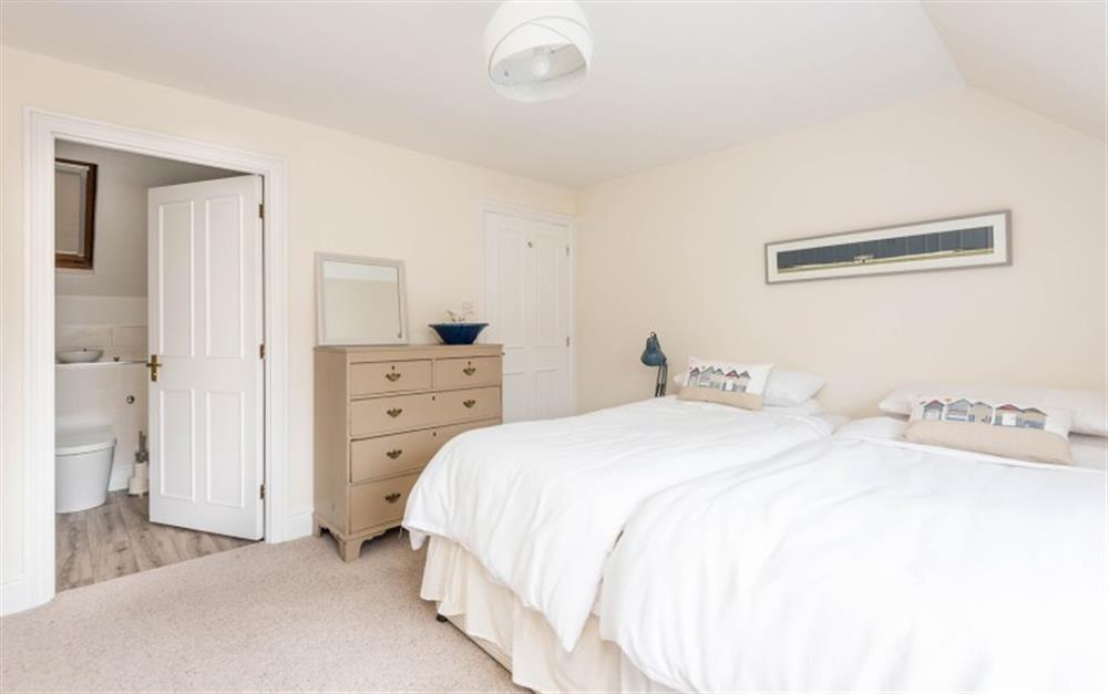 First floor bedroom with twin 3ft beds and ensuite bathroom at Clock Cottage in Dittisham