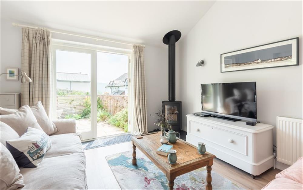 The lounge with log burner  at Clock Cottage in Dittisham