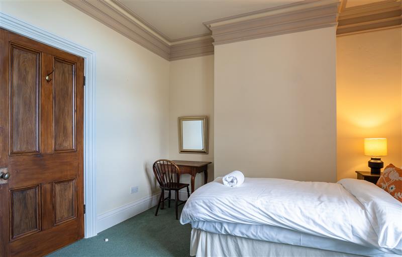 A bedroom in Clock Tower Apartment at Clock Tower Apartment, Berrynarbor near Ilfracombe