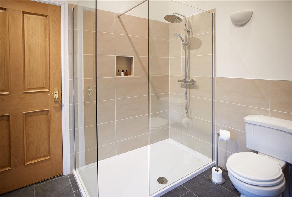 Bathroom with roll top bath and separate, walk-in shower (photo 2) at Clock Tower Apartment, Netherby Hall, Longtown