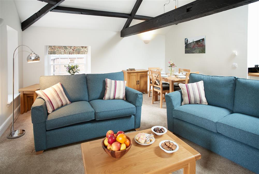 Comfortable sitting area at Clock Tower Apartment, Netherby Hall, Longtown