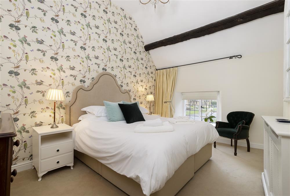 Bedroom one with a comfy super-king size bed at Closes Farm Cottage, Broadway