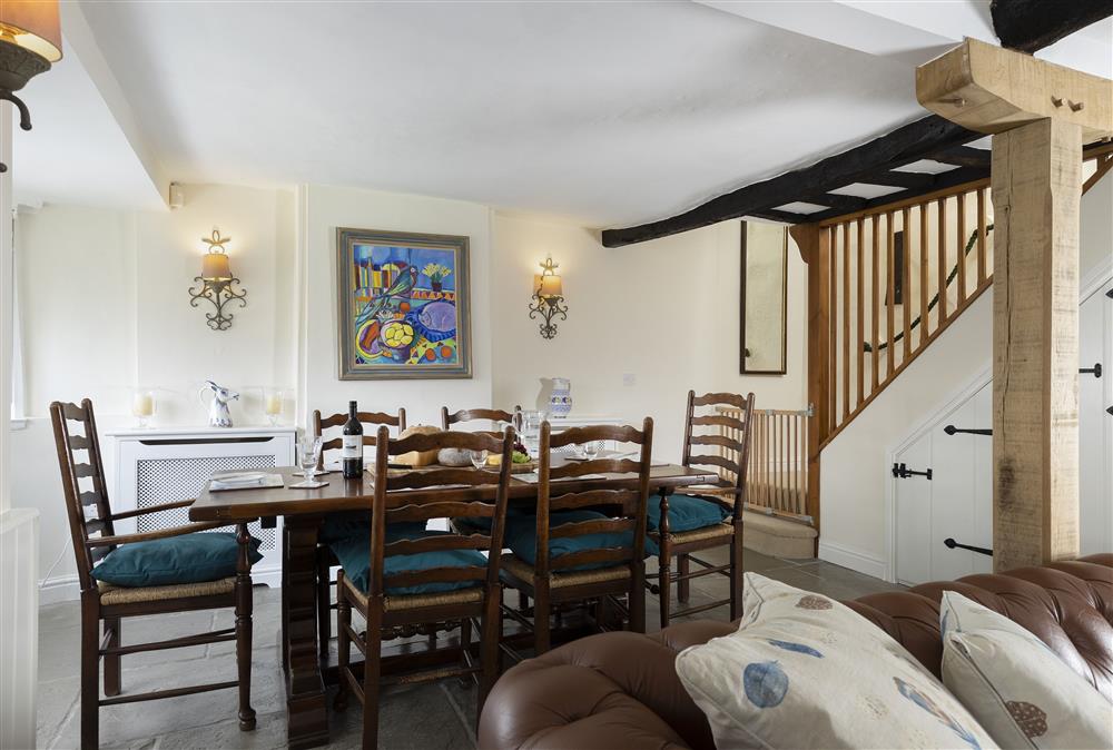 Dining area and staircase. Three fixed retractable stair gates are provided, making life easy and relaxing with young children and pets